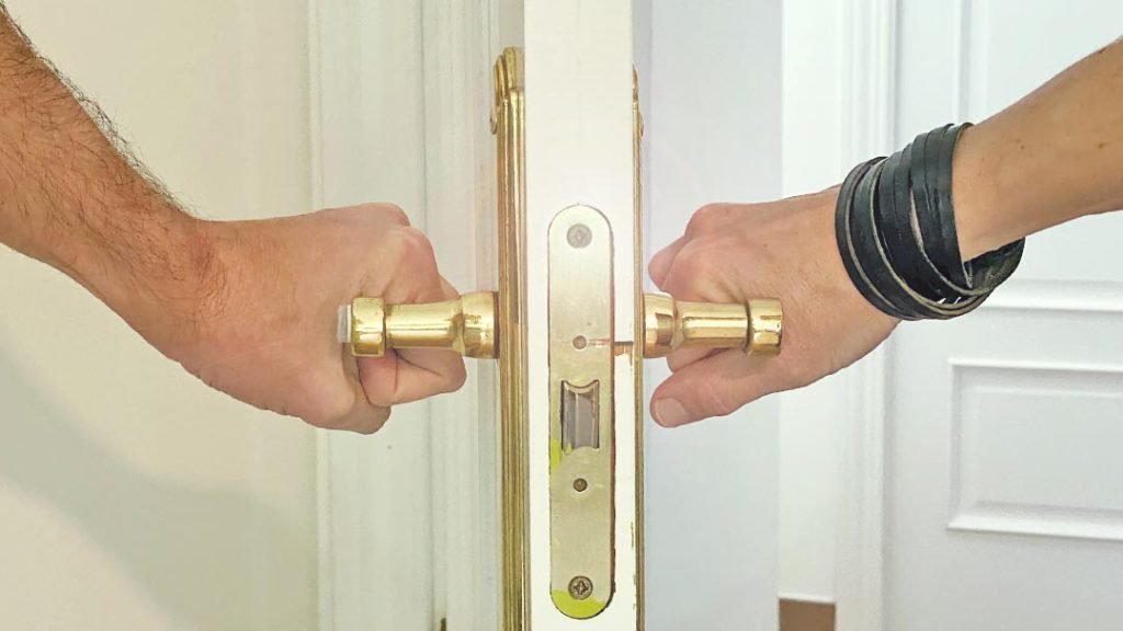 Traditional Spanish door with bronze knob details