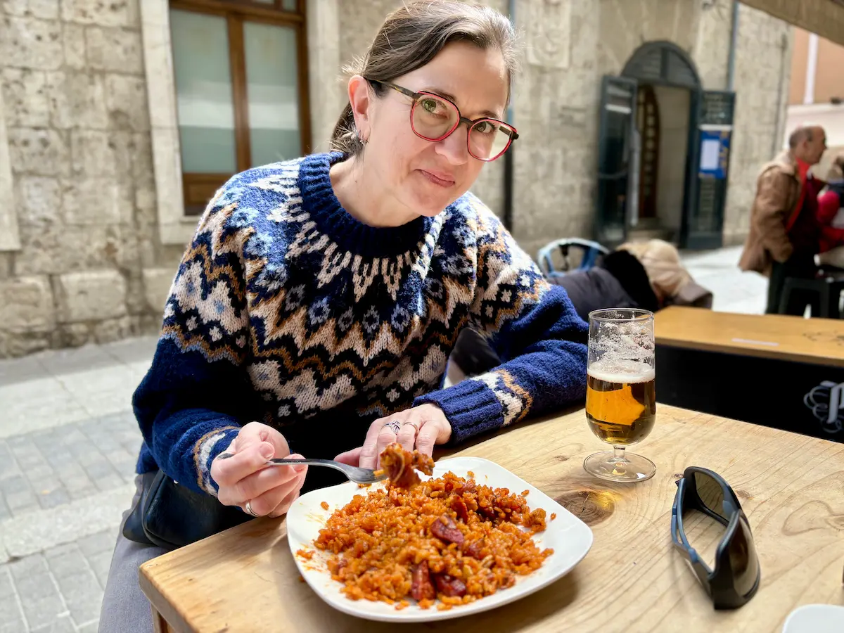 Amanda enjoying an authentic arroz con oreja tapa at a secret local spot in Valladolid Spain